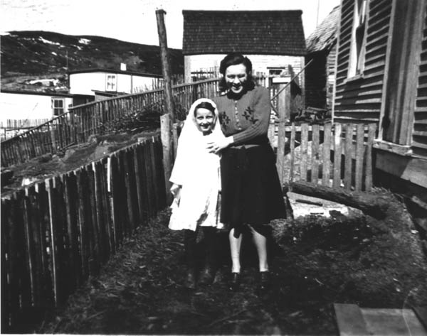 035: Mollie McCarthy and Marie Ryan in her First Communion dress. (circa 1942)  - Mollie daughter of James McCarthy &amp;amp; Julia Reddy; Marie daughter of Joseph Ryan &amp;amp; Ursula  Barry.